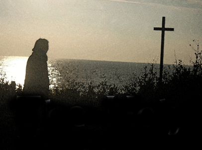 a man beside a cross